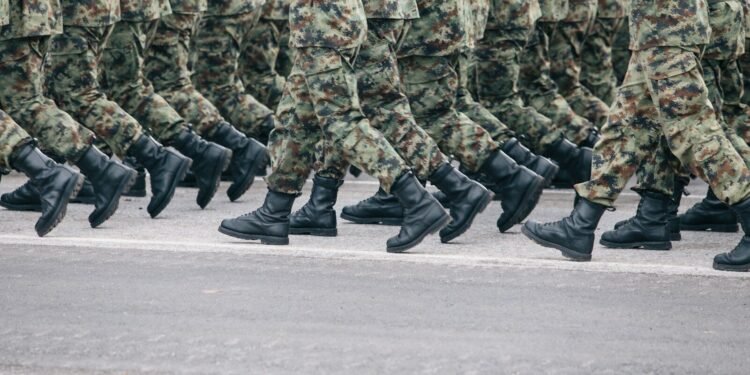 men in green and brown camouflage uniform