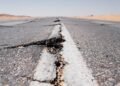 a crack in the middle of a road in the middle of nowhere