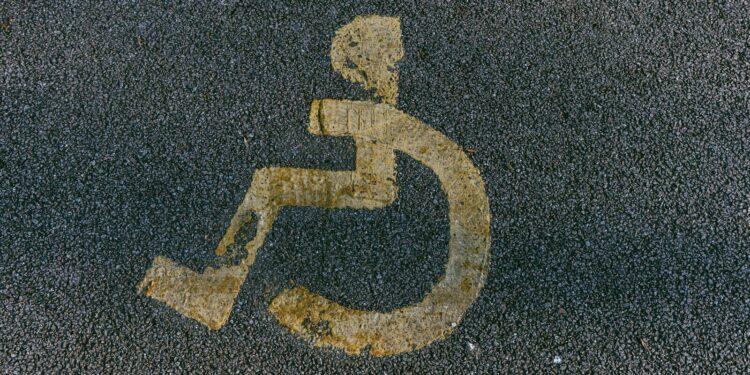 a handicapped sign is painted on the pavement