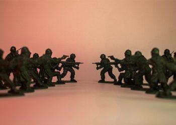 Toy soldiers in a standoff against each other.