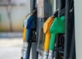 a row of gas pumps filled with gas