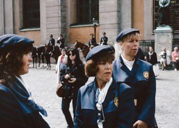 A group of women standing next to each other