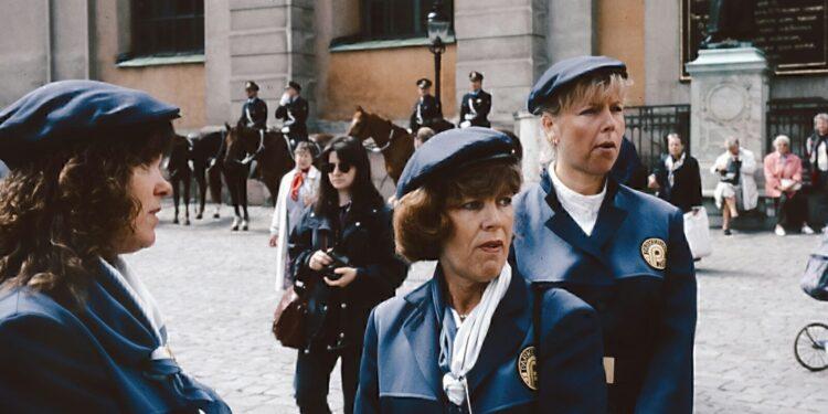 A group of women standing next to each other
